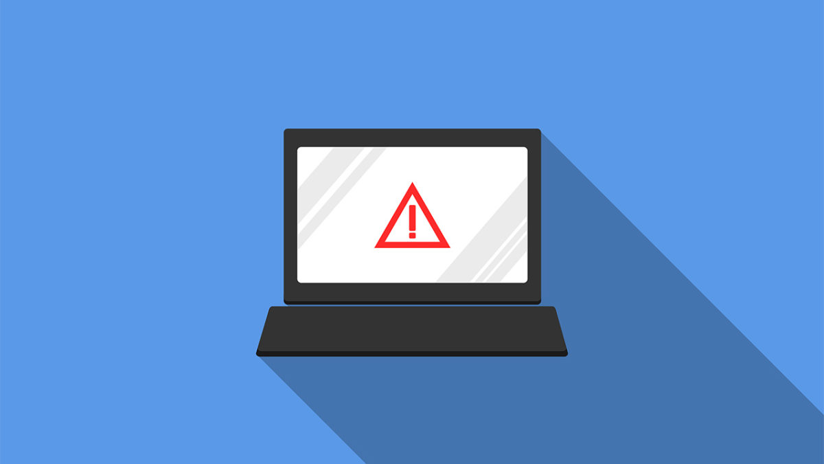 a laptop with a warning sign