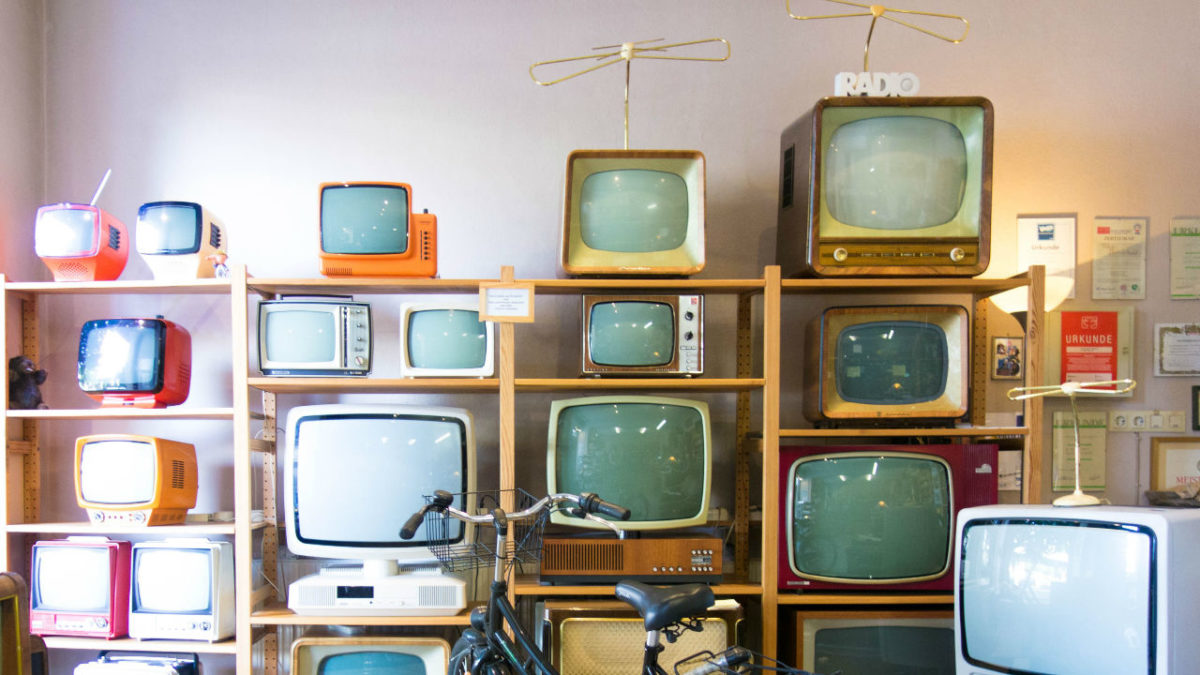Shelf full of tvs