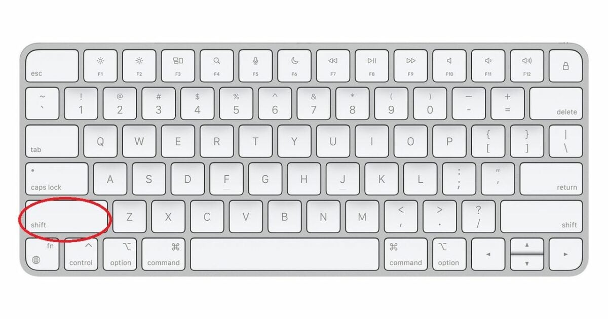 A Mac keyboard with a circle on the shift key