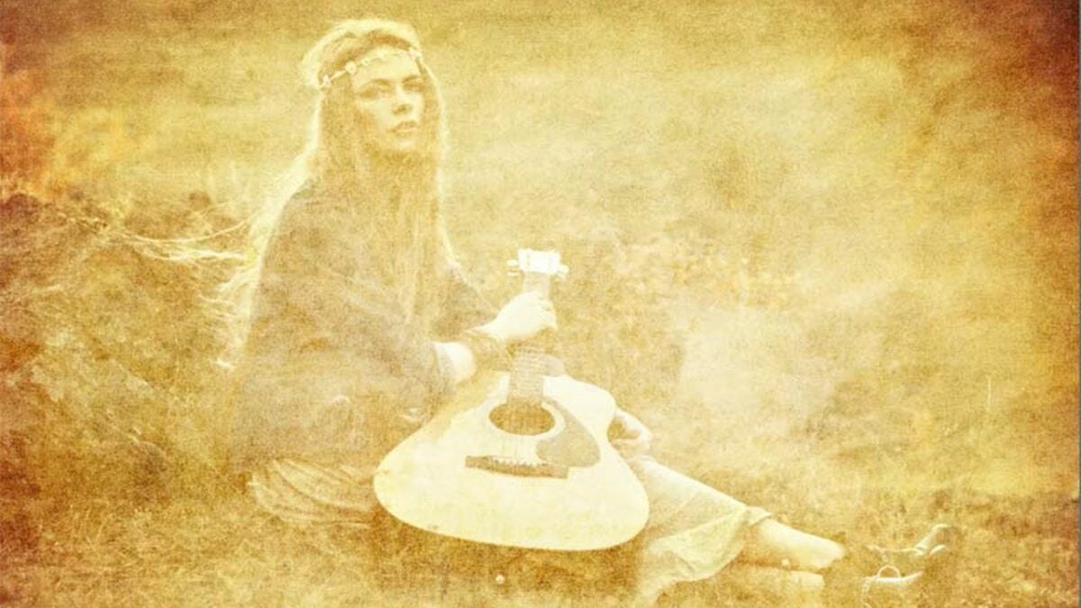 Photoshop textured Image of a girl with a guitar.
