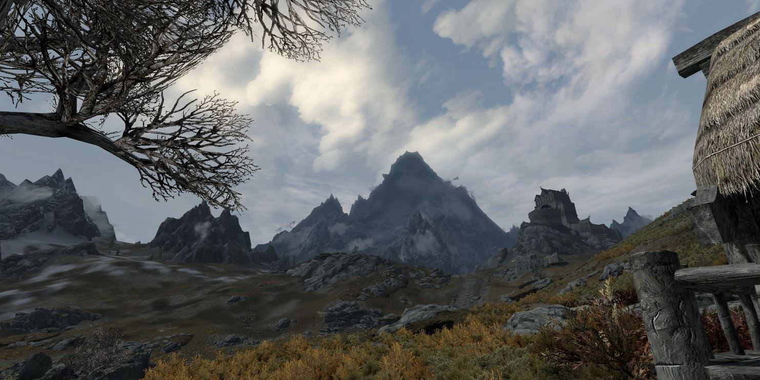 Swirling clouds over high mountain peaks.