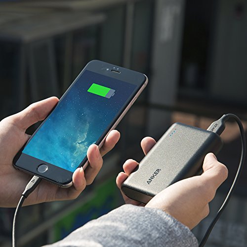 Charging an iPhone with an Anker 10000 portable charger.