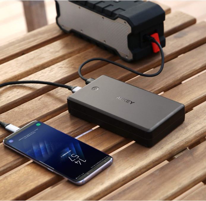 Aukey portable charger charging an iPhone