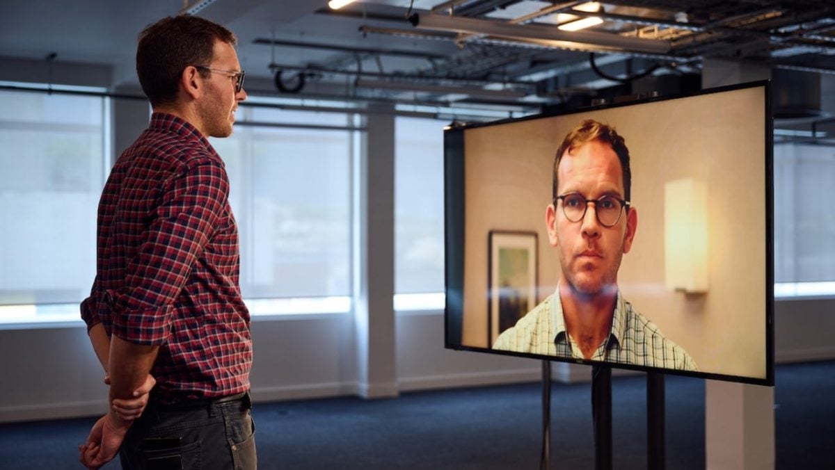 They are broadcasting a program on television about whether AI will take our jobs, and in fact, AI has taken someone's job on that program
